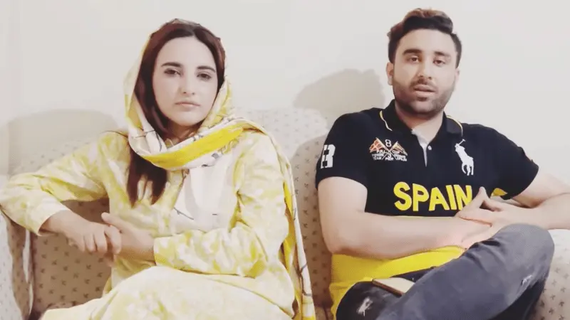 Bilal Shah, the husband of Hareem Shah, a popular TikToker, expressed his disappointment and anger at the leaking of his wife’s private videos on social media. Despite the advice of others to leave his wife during this challenging time, Bilal pledged to stand by her side. In a recent video, the couple claimed that their videos were leaked by Hareem’s friends, Sandal Khattak and Ayesha Naz, due to differences that arose between them. Hareem revealed that her friends had leaked the videos with the intent of defaming her character. Bilal expressed his frustration and disappointment in his wife’s friends, who were once trusted guests in their home and had shared rooms with Hareem. He never expected them to betray their friend in such a manner, especially considering that they were women themselves. Their actions have violated and smeared the character of a woman, he added. According to a report by Geo News, Bilal plans to take legal action against Hareem’s friends upon their return to Pakistan. He believes that leaving his wife in her hour of need would be unjust, and he intends to stand by her and support her through this difficult time. Hareem expressed regret for trusting her friends and allowing them access to everything in her home. She confirmed that the leaked videos were genuine and that her friends had threatened to leak them earlier. The couple’s decision to publicly address the issue and stand together has earned them praise from their fans. However, some people have criticized Bilal for supporting his wife despite the controversy, but he believes that a real man stands by his wife in times of need and supports her, while those who abandon their wives are not real men.